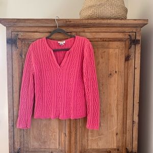 bright pink cable-knit sweater